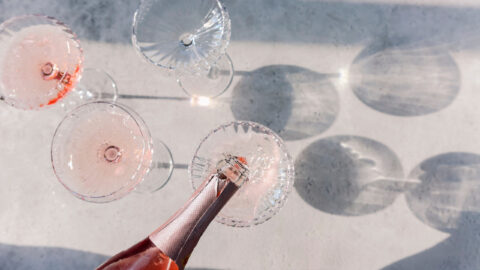 Glasses,With,Cold,Pink,Champagne,Placed,On,Table,In,A